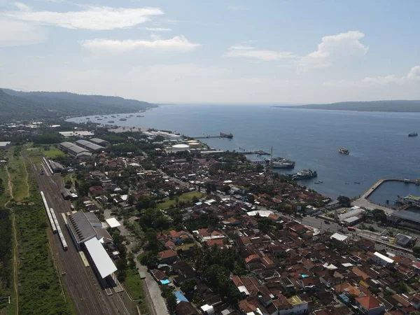 Aerial view of train stasiun with ferry port background in Banyuwangi, Indonesia