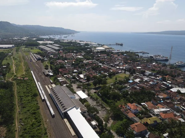 Aerial view of train stasiun with ferry port background in Banyuwangi, Indonesia