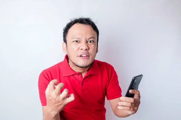 Angry Young Asian Man Looks Disgruntled Wearing Red Shirt Irritated — Stock Photo, Image