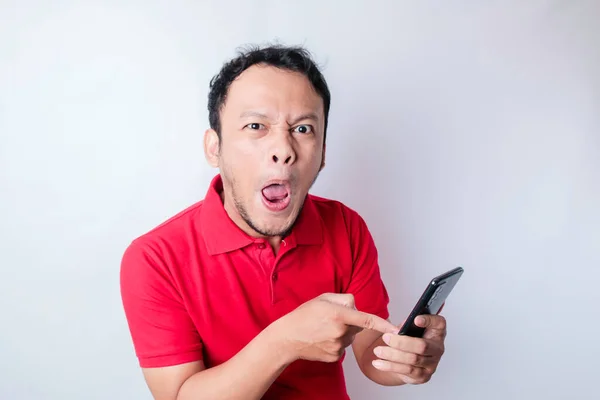 Angry Young Asian Man Looks Disgruntled Wearing Red Shirt Irritated — Stock Photo, Image