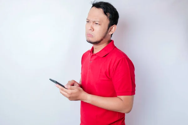 Dissatisfied Young Asian Man Looks Disgruntled Wearing Red Shirt Irritated — Stock Photo, Image