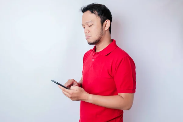 Dissatisfied Young Asian Man Looks Disgruntled Wearing Red Shirt Irritated — Stock Photo, Image