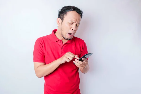 Dissatisfied Young Asian Man Looks Disgruntled Wearing Red Shirt Irritated — Stock Photo, Image