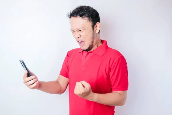 Young Asian Man Happy Successful Expression Wearing Red Shirt Holding — Stock Photo, Image