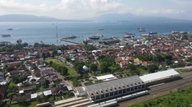 Aerial view of train stasiun with ferry port background in Banyuwangi, Indonesia