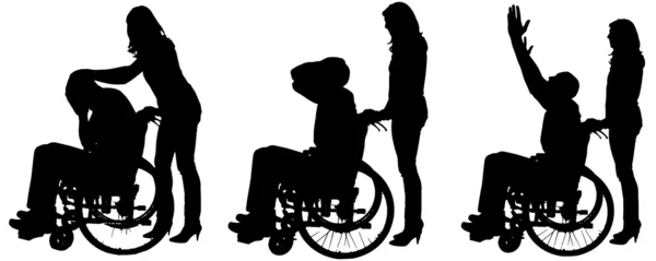 Vector silhouettes of people in a wheelchair. — Stock Vector