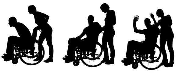 Vector silhouettes of people in a wheelchair. — Stock Vector