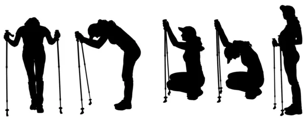 Vector silhouettes of people with trekking stick. — Stock Vector