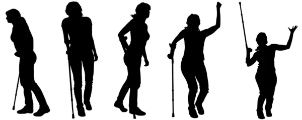 Vector silhouettes of people with crutches. — Stock Vector