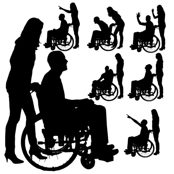 Vector silhouettes of people in a wheelchair. — Stock Vector