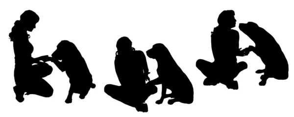 Vector silhouet van een vrouw met een hond. — Stockvector