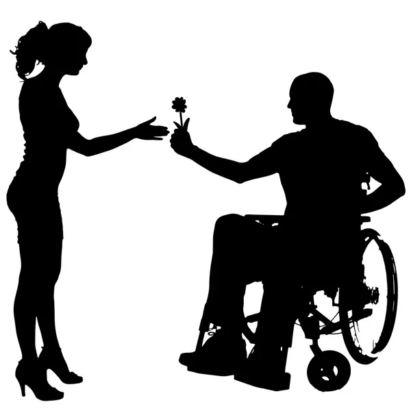 Vector silhouettes of people in a wheelchair. — Stock Vector