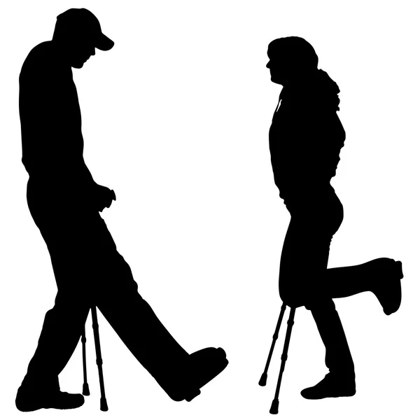 Vector silhouettes of people with crutch. — Stock Vector