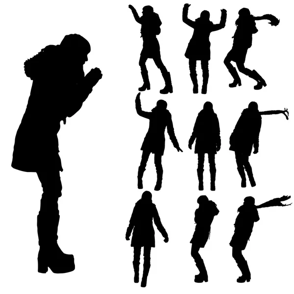 Silhouette vectorielle de la femme en vêtements d'hiver . — Image vectorielle