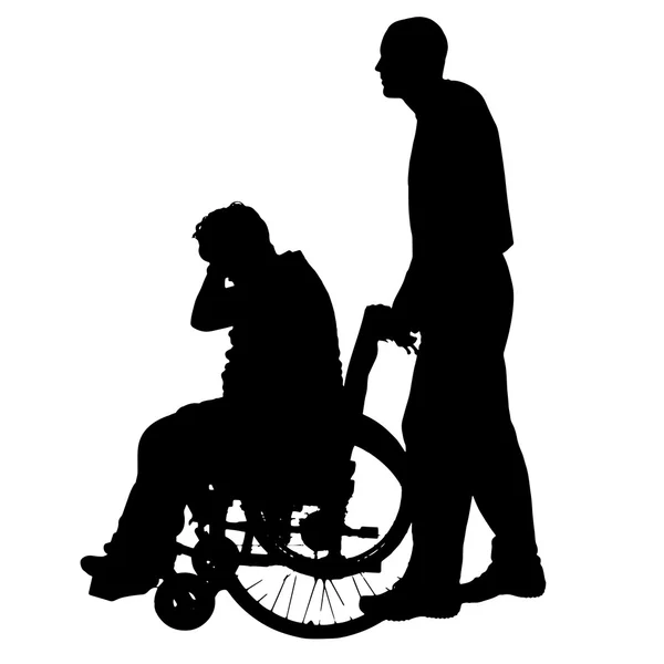 Vektorsilhouetten von Menschen im Rollstuhl. — Stockvektor