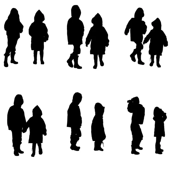 Vector silhouette of children in raincoats. — Stock Vector