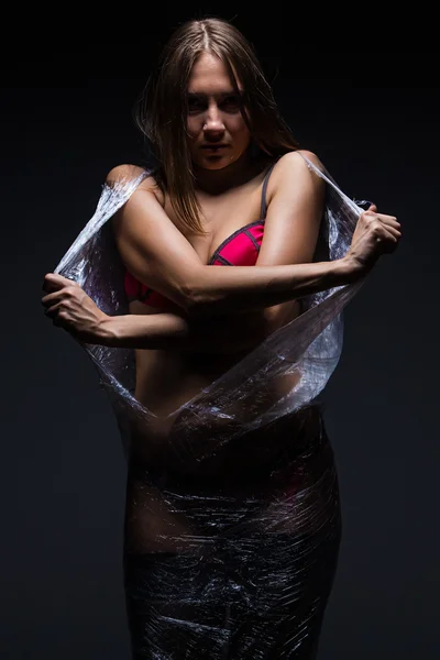 Girl in polythene — Stock Photo, Image