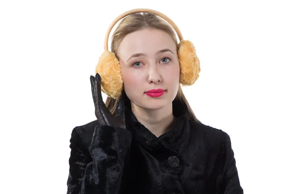 Porträtt av en kvinna med hörselkåpor — Stockfoto