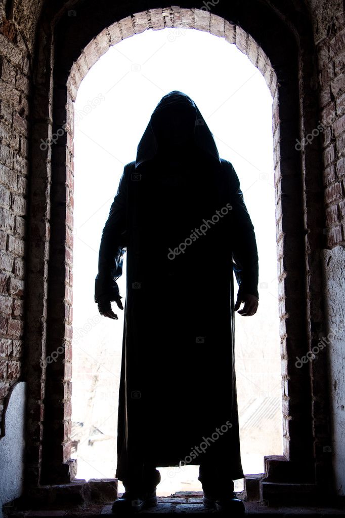 Silhouette of a man in arch