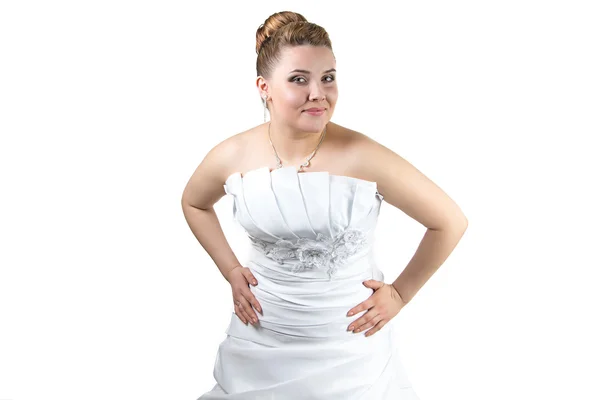 Woman in wedding dress with hands ob her waist — Stock Photo, Image