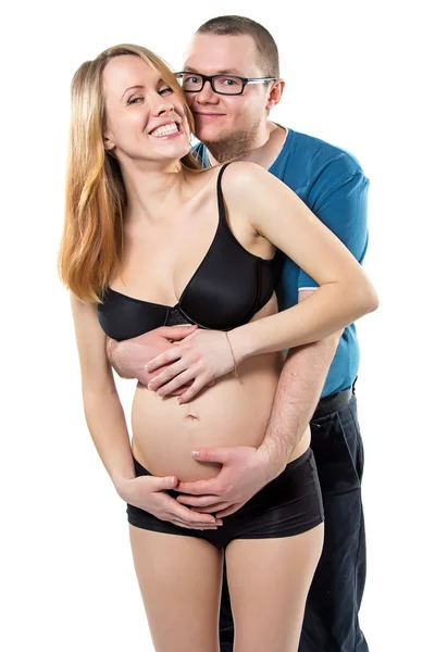 Těhotná žena a její šťastný manžel směje — Stock fotografie