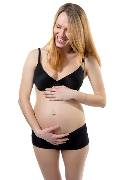 Femme enceinte avec le ventre riant — Photo