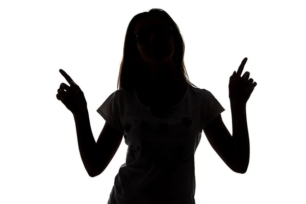 Silhouette of teenager girl with fingers up — Stock Photo, Image