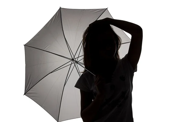 Silhouette of teenager girl with umbrella — Stock Photo, Image