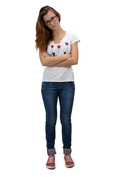 Tonåring tjej med glasögon och armarna korsade — Stockfoto