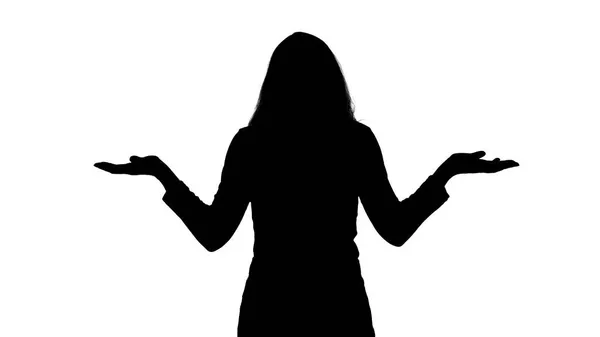 Photo de la silhouette femme haussant les épaules sur blanc — Photo
