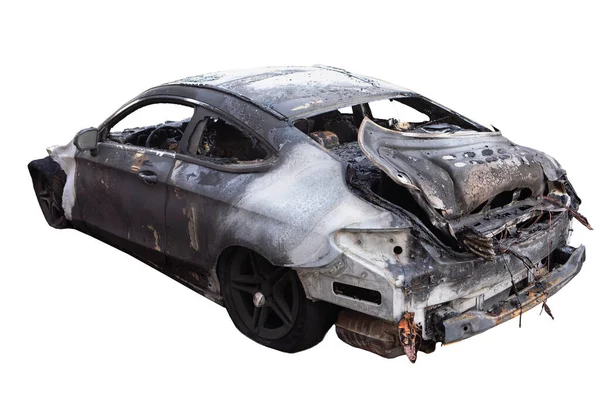 Burned car from behind isolated on white background. Car Wreck  after car accident,  fire, crime of vandalism, riots. Arson car after explosion.