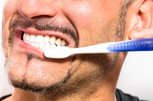 Young Man brushing white perfect Teeth with a Toothbrush — Stock Photo, Image