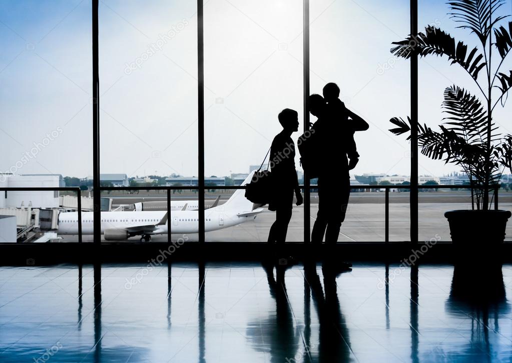 Family in a nice moment at Airport waiting for departure