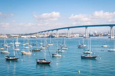 San Diego waterfront with sailing Boats - Indutrial harbor and C clipart