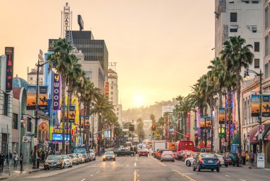 LOS ANGELES - DECEMBER 18, 2013: View of Hollywood Boulevard at sunset. In 1958, the Hollywood Walk of Fame was created on this street as a tribute to artists working in the entertainment industry. clipart