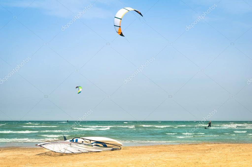 Kite surfing in desert windy beach with windsurf board Exlcusive