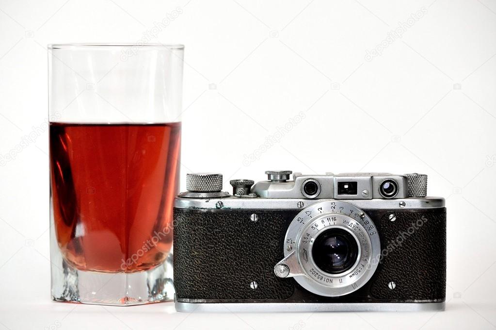 Camera and glass of wine