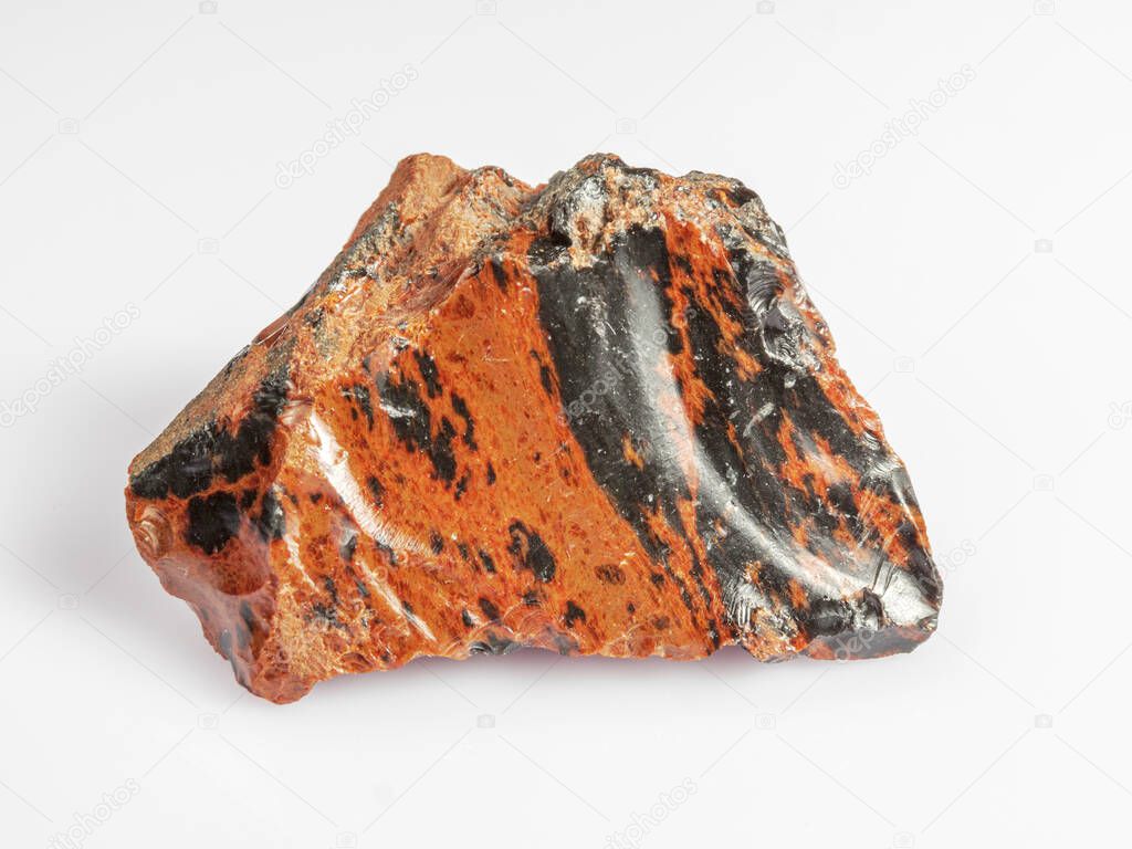 Obsidian mahogany. Igneous rock. White background. Magma glass.