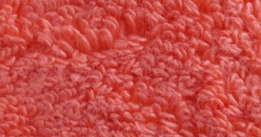 Terry havlu dokusunu kapat. Kırmızı arkaplan.