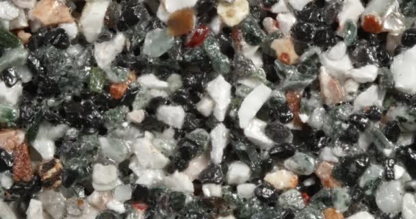 Close-up texture of fine marble chips. Multi color. — Stock Video