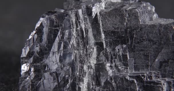 Panorama galena mineral on a black background. Lead ore. — Wideo stockowe