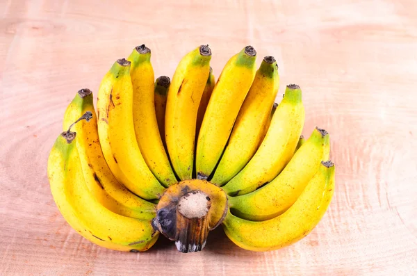 Fresh bananas on wooden background — Stock Photo, Image