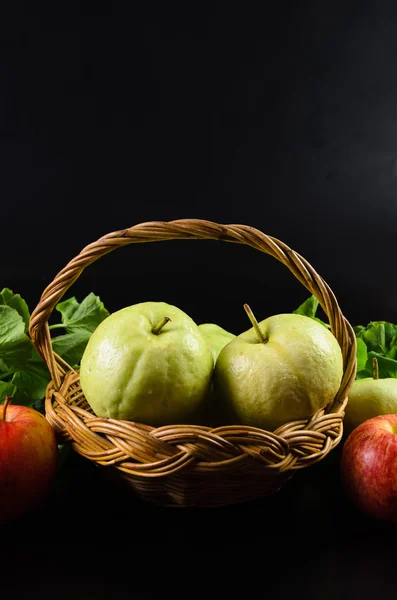 Guava and Asiatic in the basket on black background — Stock Photo, Image