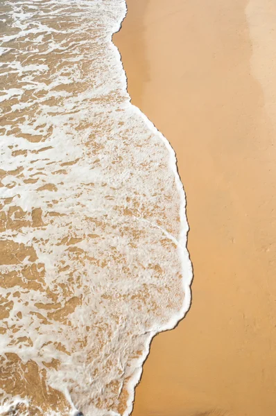 Wave at the sand beach — Stock Photo, Image