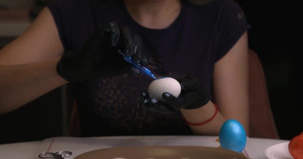 Girl Paints Easter Eggs Her Hands Black Gloves — Stock videók