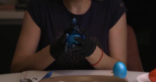 Girl Paints Easter Eggs Her Hands Black Gloves — Stockvideo