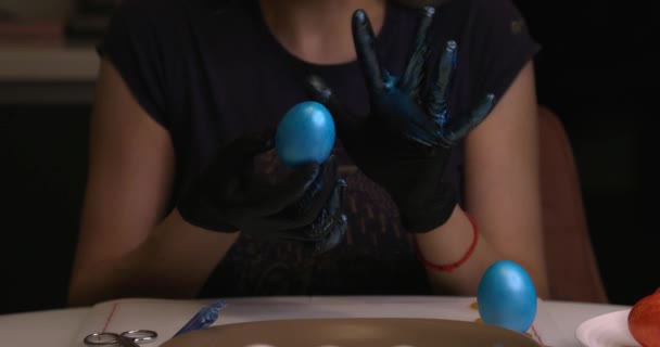 Girl Paints Easter Eggs Her Hands Black Gloves — Stok video