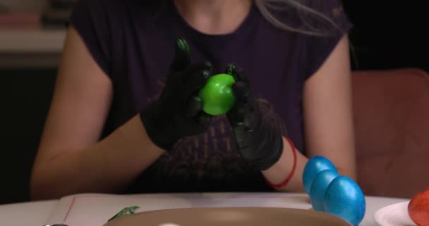 Girl Paints Easter Eggs Her Hands Black Gloves — ストック動画