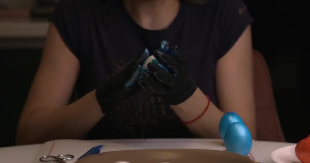 Girl Paints Easter Eggs Her Hands Black Gloves — ストック動画