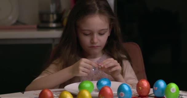 Girl Glues Decorative Stickers Easter Eggs Folds Them Easter Eggs — 图库视频影像